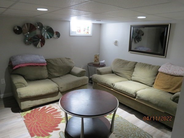 312 America Street Fall River, MA 02721 - Photo 18 of 26 a living room with furniture and a wooden floor
