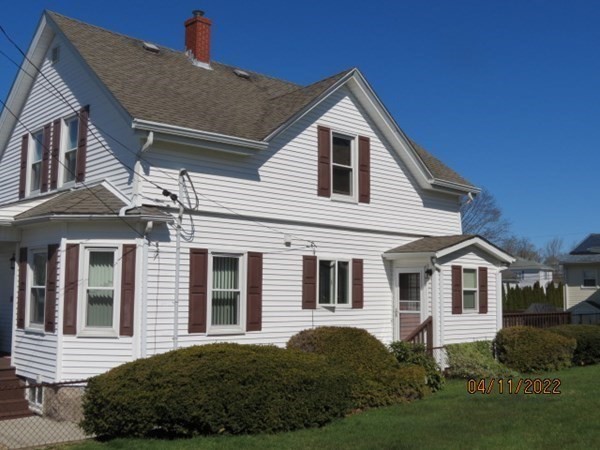 312 America Street Fall River, MA 02721 - Photo 2 of 26 a front view of a house with a yard