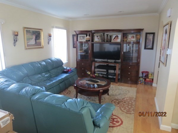 312 America Street Fall River, MA 02721 - Photo 3 of 26 a living room with furniture and a flat screen tv