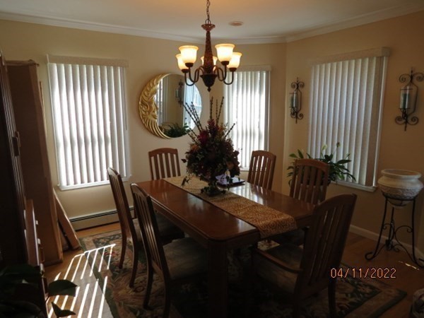 312 America Street Fall River, MA 02721 - Photo 4 of 26 a view of a dining room with furniture and a chandelier