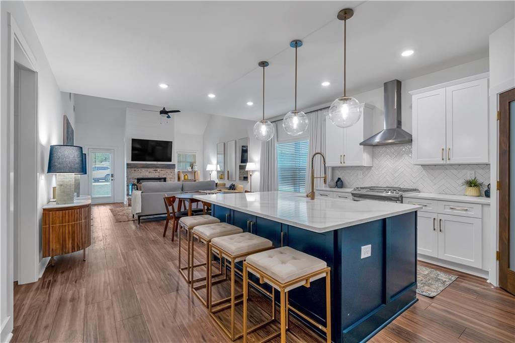 50 Puckett Road Emerson, GA 30137 - Photo 11 of 26 a kitchen with a table chairs stove and kitchen island