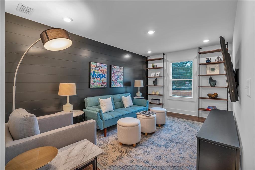 50 Puckett Road Emerson, GA 30137 - Photo 20 of 26 a living room with furniture and a lamp