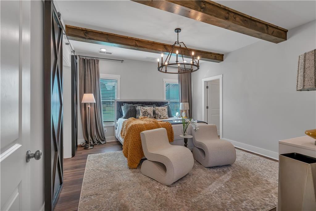 50 Puckett Road Emerson, GA 30137 - Photo 4 of 26 a living room with furniture and a chandelier