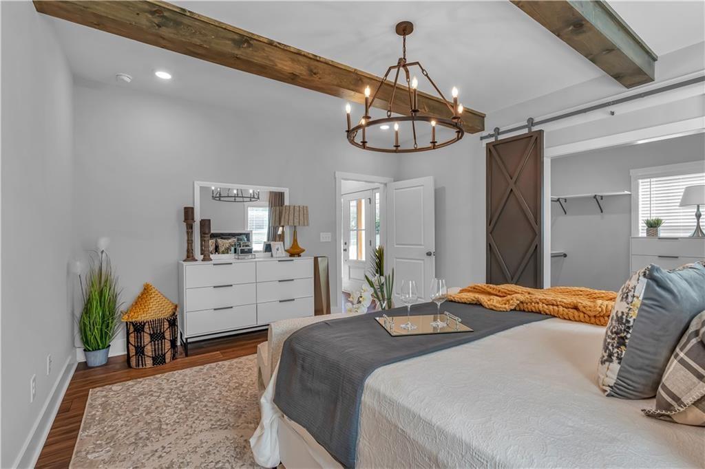 50 Puckett Road Emerson, GA 30137 - Photo 6 of 26 a bedroom with a bed and a chandelier