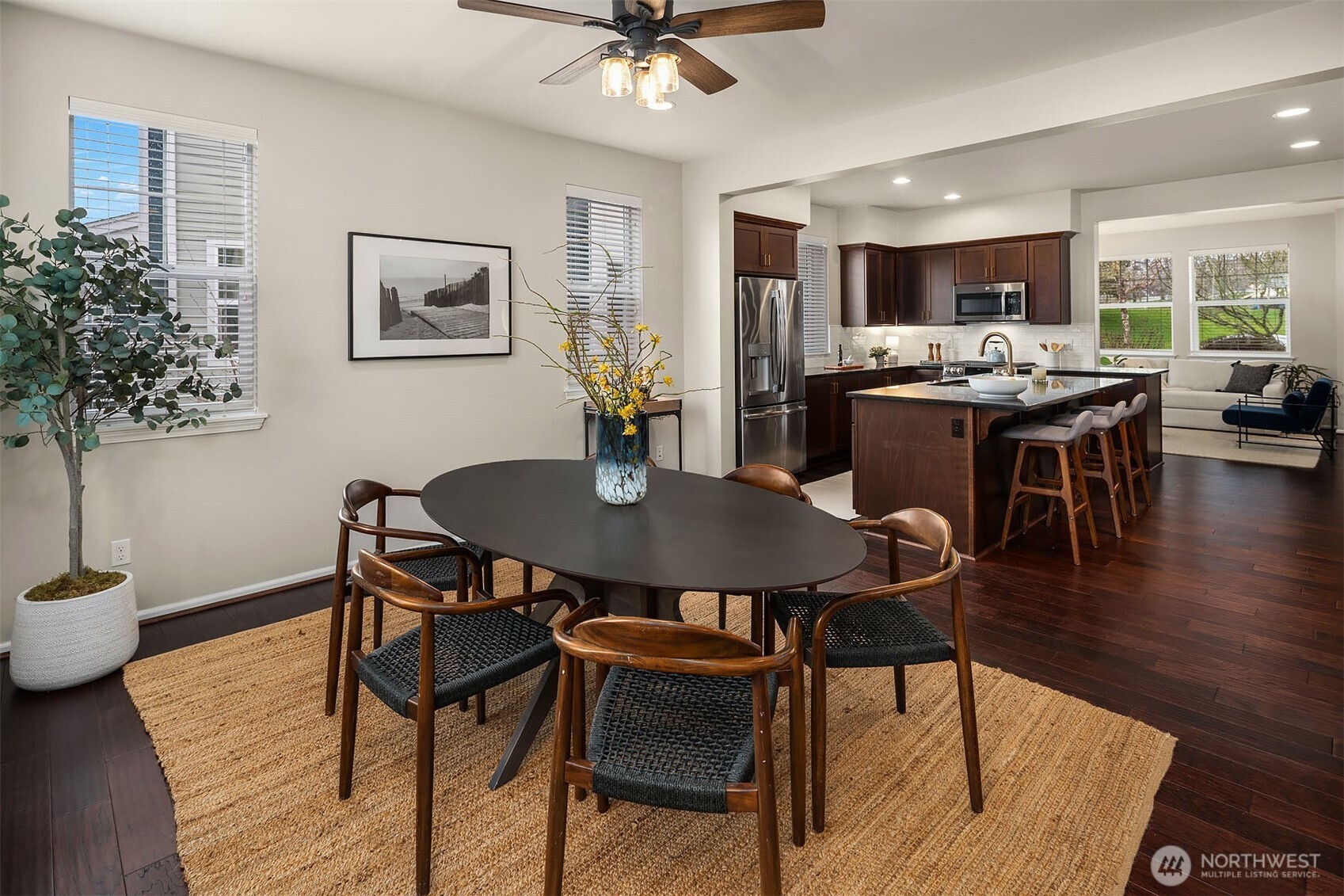 6908 31st Avenue Southwest Seattle, WA 98126 - Photo 12 of 33 a view of a dining room with furniture and wooden floor