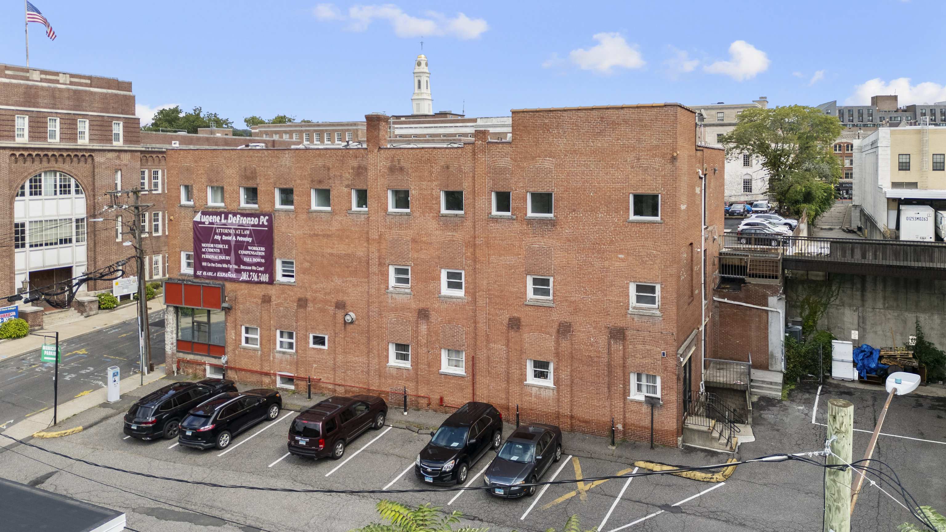 61 Field Street, Unit 211 Waterbury, CT 06702 - Photo 9 of 11 a view of a building with cars parked