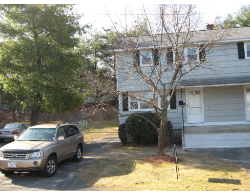 34 Charles Road, Unit 34 Winchester, MA 01890 - Photo 1 of 1 a house view with a outdoor space