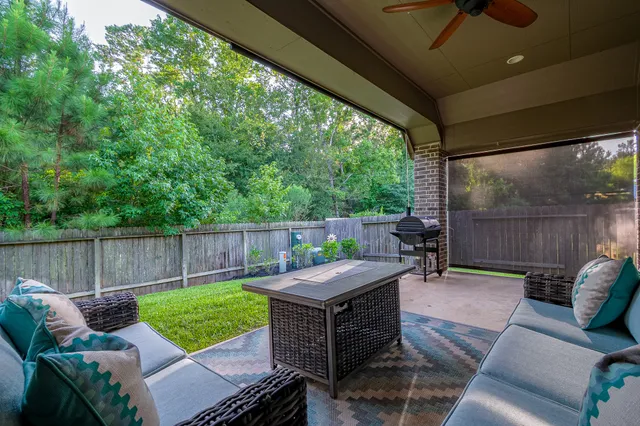 a view of a patio with couches chairs and a table