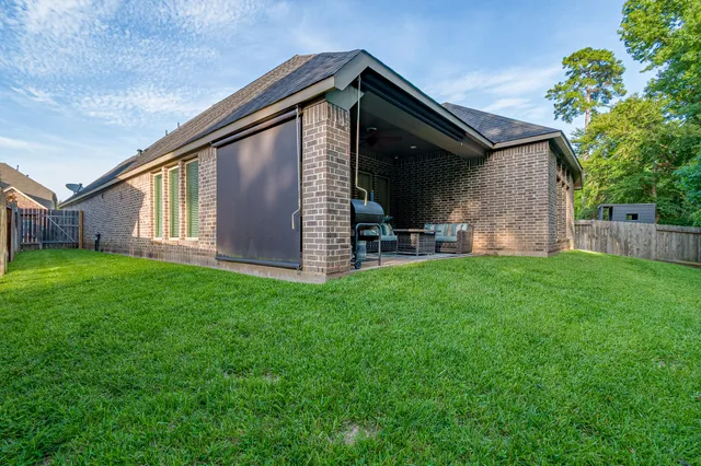 a front view of house with a garden