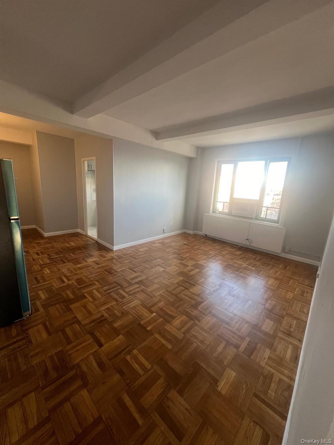 1314 Virginia Avenue, Unit 4F Bronx, NY 10462 - Photo 6 of 17 Unfurnished room with beam ceiling and baseboards