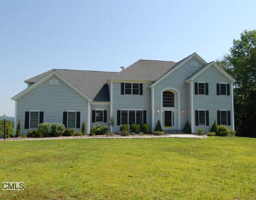 70 Parmalee Hill Road Newtown, CT 06470 - Photo 1 of 1 a front view of a house with a yard
