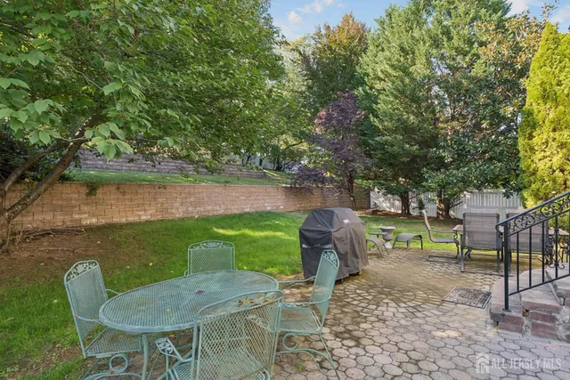 a view of a table and chairs in the garden