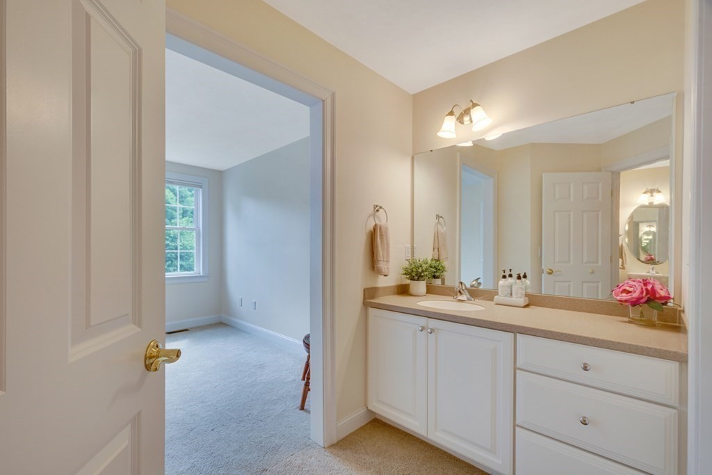 96 Summer Road, Unit 96 Boxborough, MA 01719 - Photo 17 of 26 a bathroom with a double vanity sink mirror and double