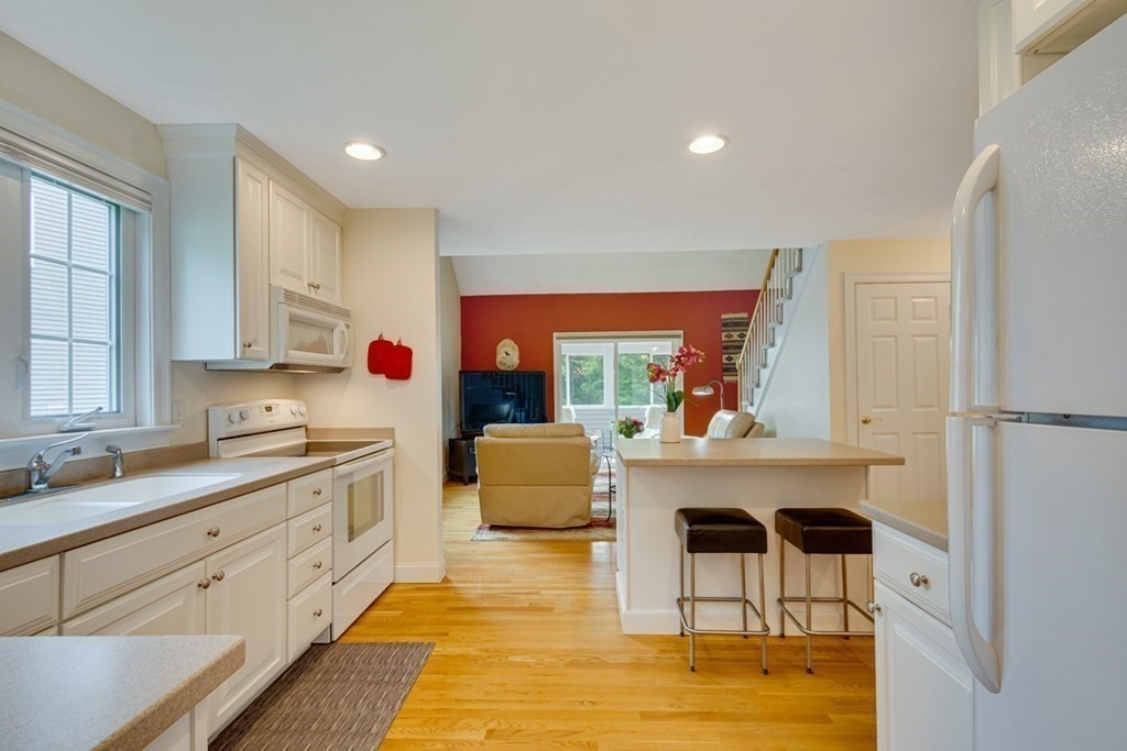 96 Summer Road, Unit 96 Boxborough, MA 01719 - Photo 6 of 26 a living room with furniture fireplace and window