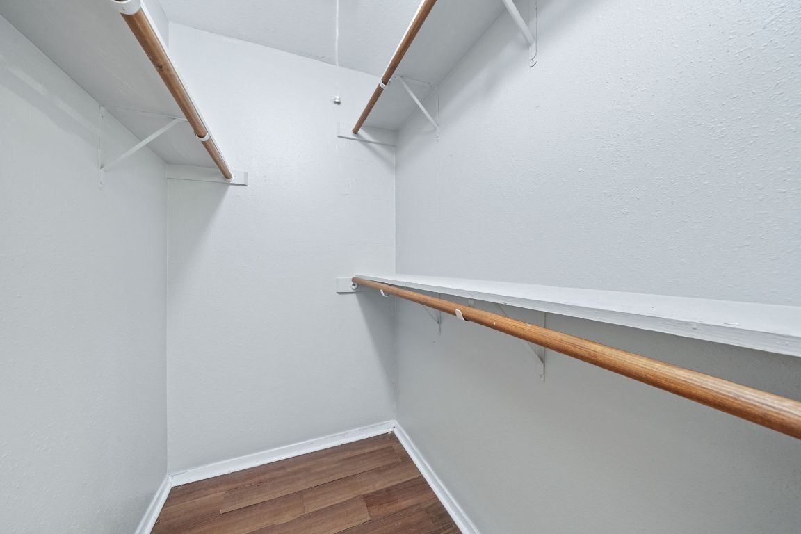 1810 Mearns Meadow Boulevard, Unit B Austin, TX 78758 - Photo 14 of 21 a view of closet with wooden floor