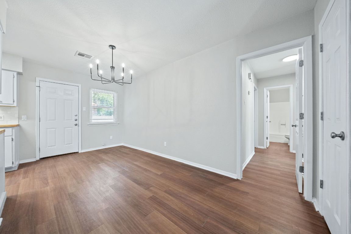 1810 Mearns Meadow Boulevard, Unit B Austin, TX 78758 - Photo 8 of 21 a view of empty room with wooden floor