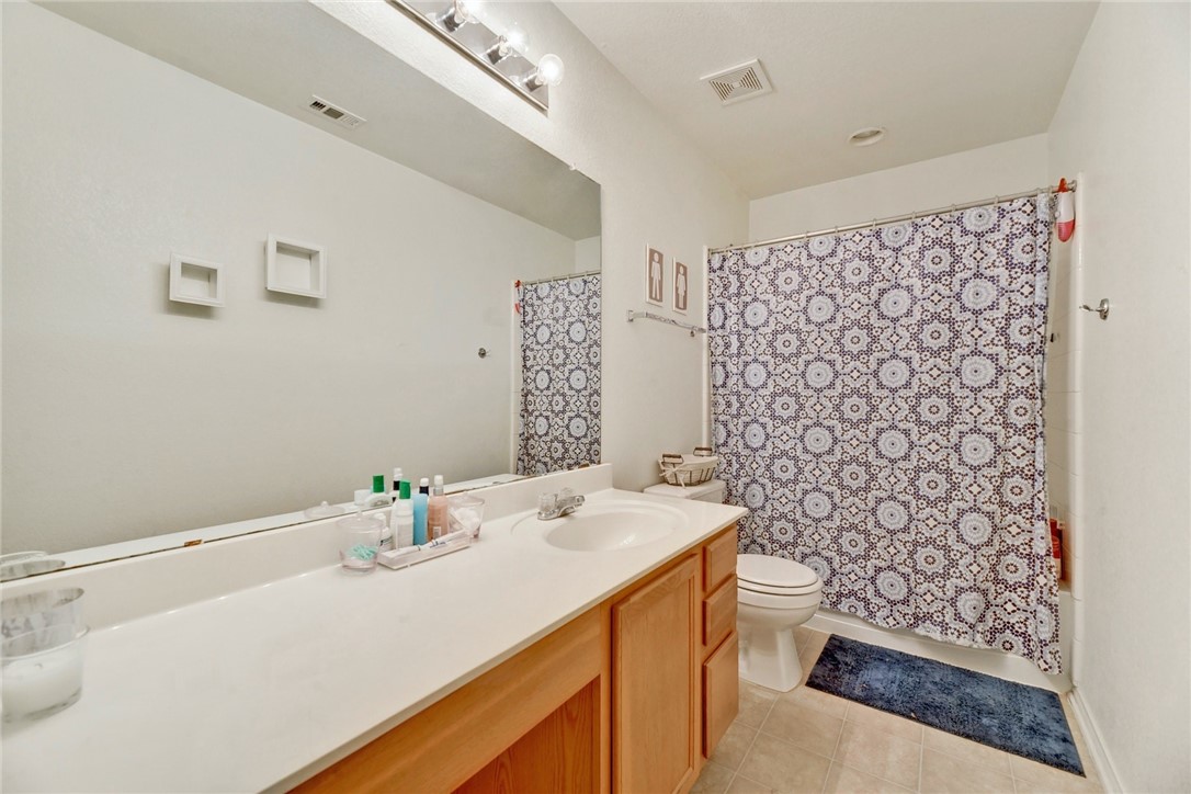 145 Rudy Lane Kyle, TX 78640 - Photo 25 of 29 a bathroom with a sink toilet and shower