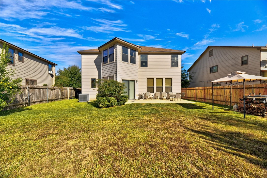 145 Rudy Lane Kyle, TX 78640 - Photo 27 of 29 a view of an house with backyard and pool