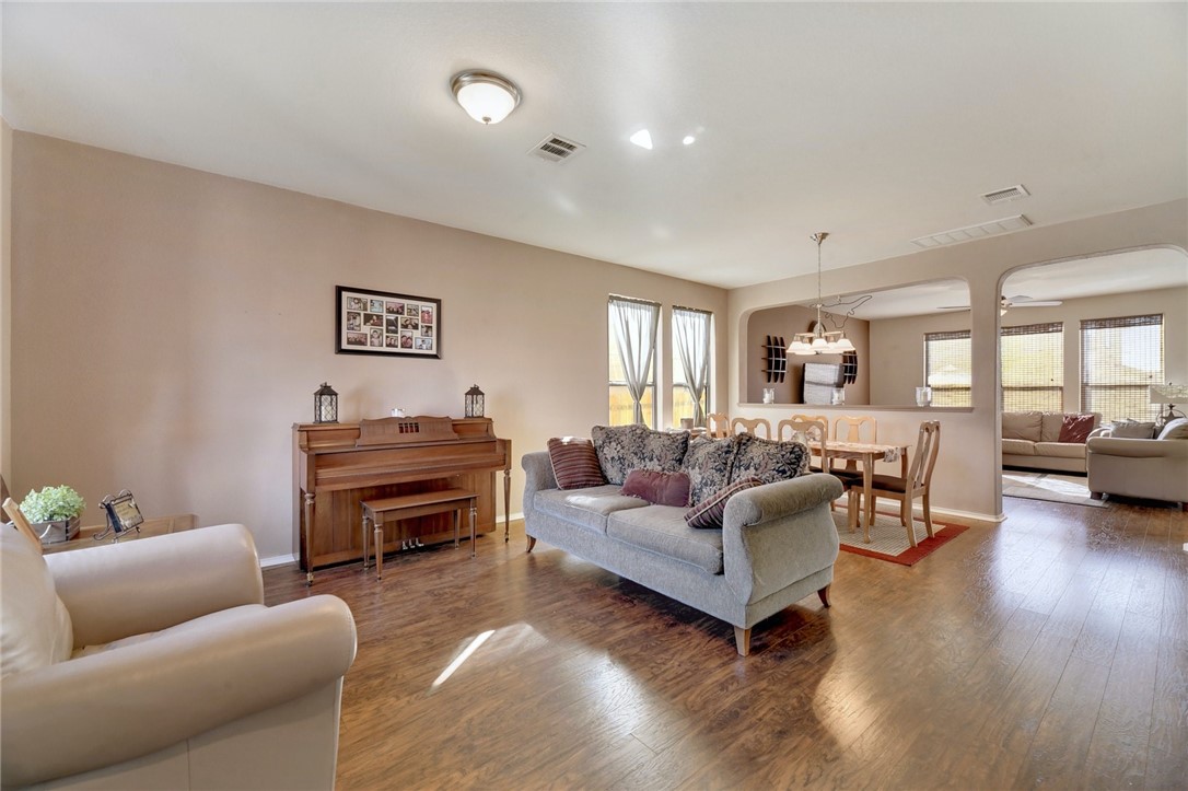 145 Rudy Lane Kyle, TX 78640 - Photo 3 of 29 a living room with furniture and a wooden floor