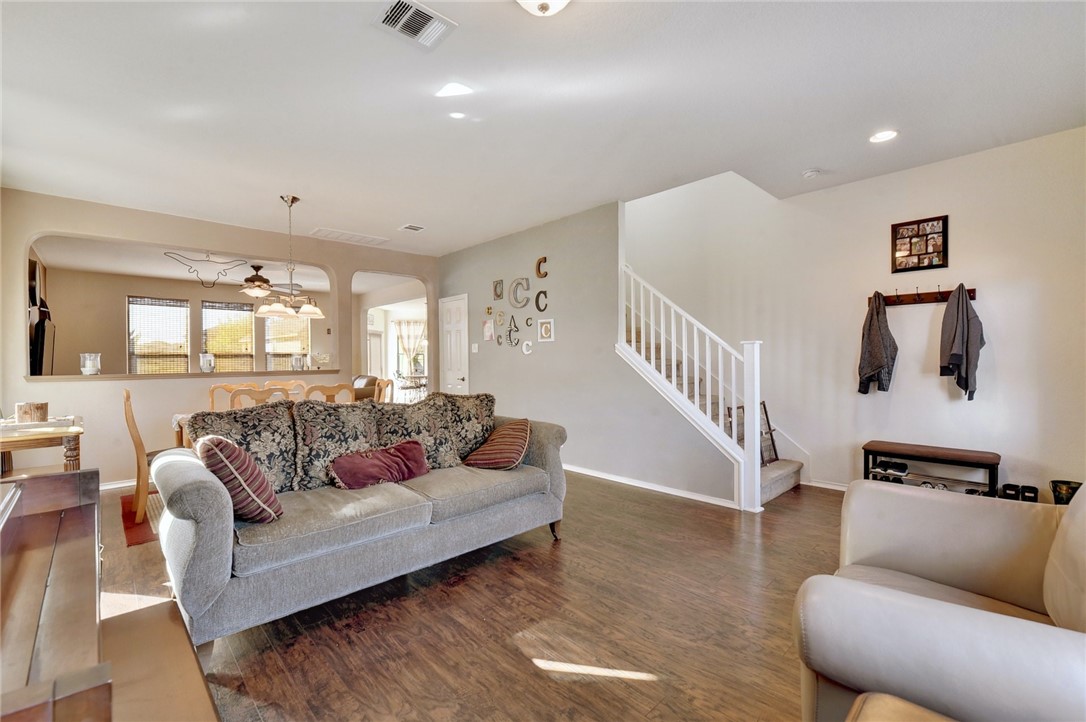 145 Rudy Lane Kyle, TX 78640 - Photo 4 of 29 a living room with furniture and a wooden floor