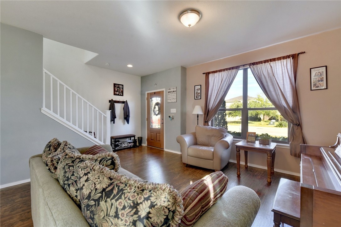 145 Rudy Lane Kyle, TX 78640 - Photo 5 of 29 a living room with furniture and a large window