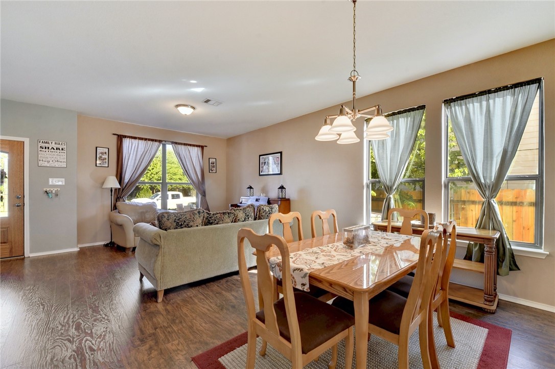 145 Rudy Lane Kyle, TX 78640 - Photo 7 of 29 a living room with furniture and a large window