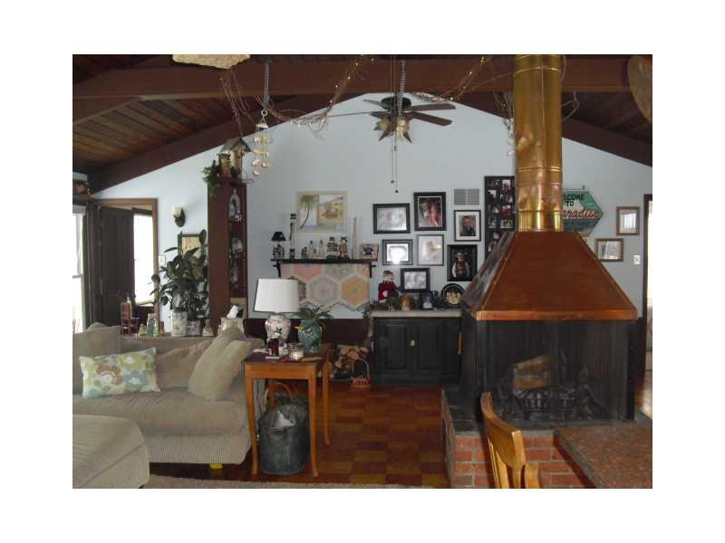 130 Germaine Road Butler, PA 16001 - Photo 3 of 25 Great Room. Large open great room with cathedral ceiling and wood beams is warmed by the copper fireplace.