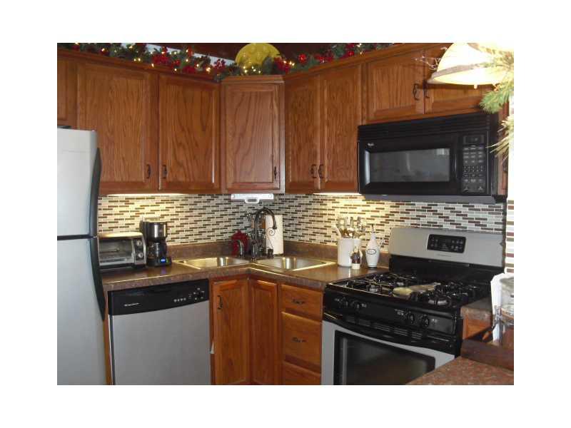 130 Germaine Road Butler, PA 16001 - Photo 4 of 25 Kitchen. Beautiful oak kitchen with glass tile backsplash and breakfast bar.