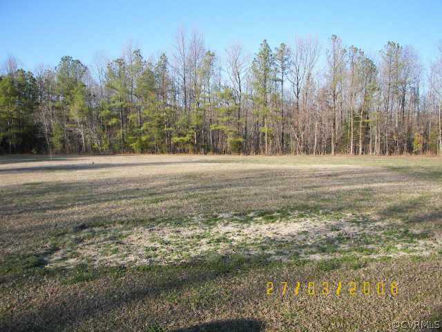 11543 Doswell Road Doswell, VA 23047 - Photo 4 of 8 a view of a field with trees in the background