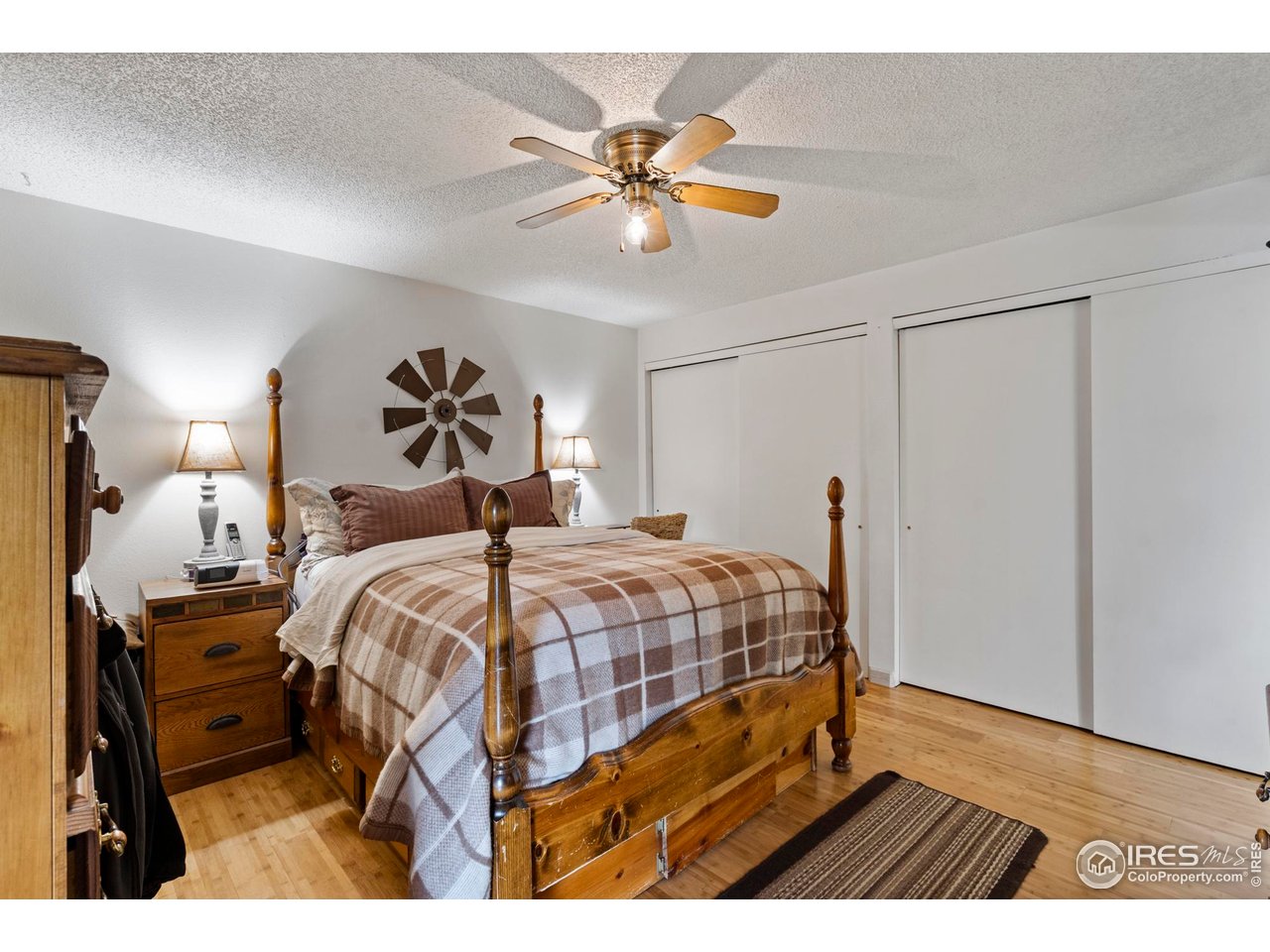 123 Mohawk Road Lyons, CO 80540 - Photo 18 of 38 a bedroom with a bed and a chandelier