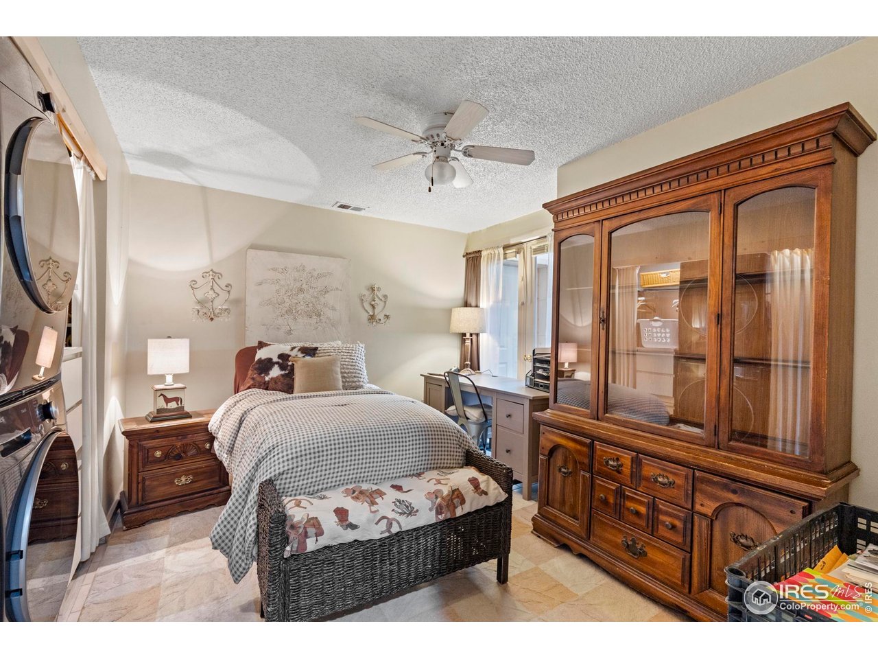 123 Mohawk Road Lyons, CO 80540 - Photo 20 of 38 a bedroom with a bed next to a window