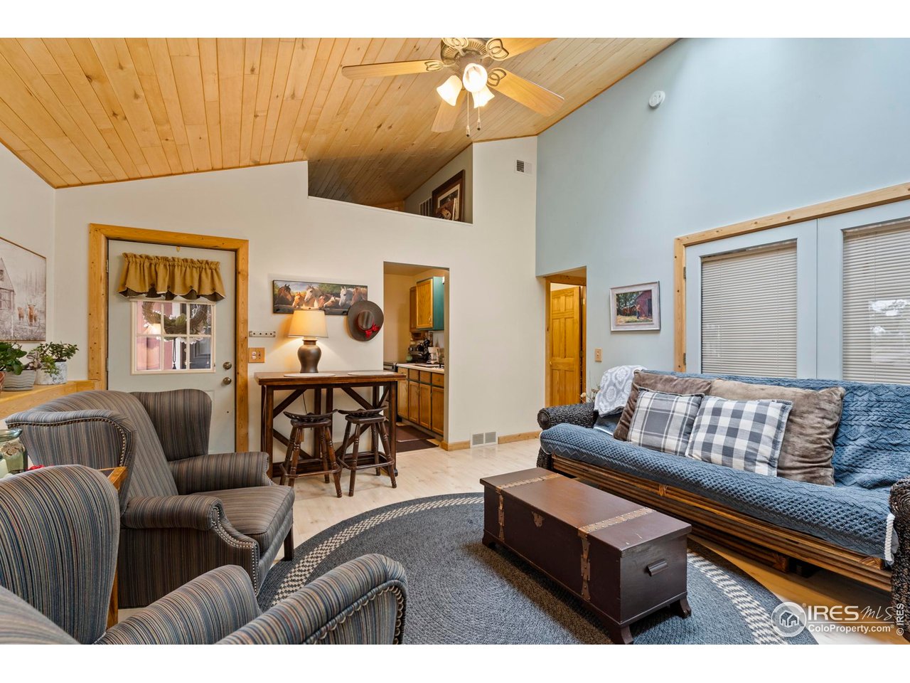 123 Mohawk Road Lyons, CO 80540 - Photo 27 of 38 a living room with furniture and wooden floor