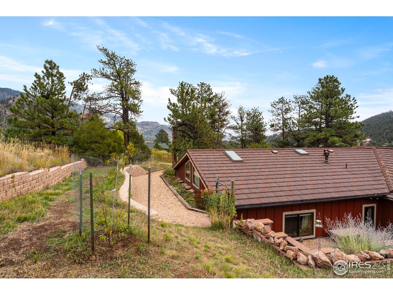 123 Mohawk Road Lyons, CO 80540 - Photo 35 of 38 a front view of a house with a yard