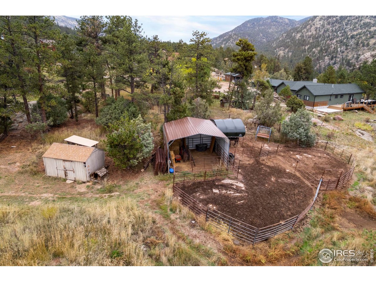 123 Mohawk Road Lyons, CO 80540 - Photo 36 of 38 a backyard of a house with table and chairs
