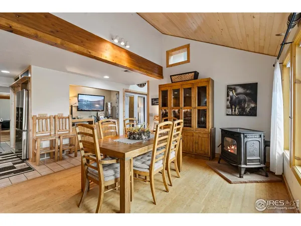a dining room with furniture and fireplace