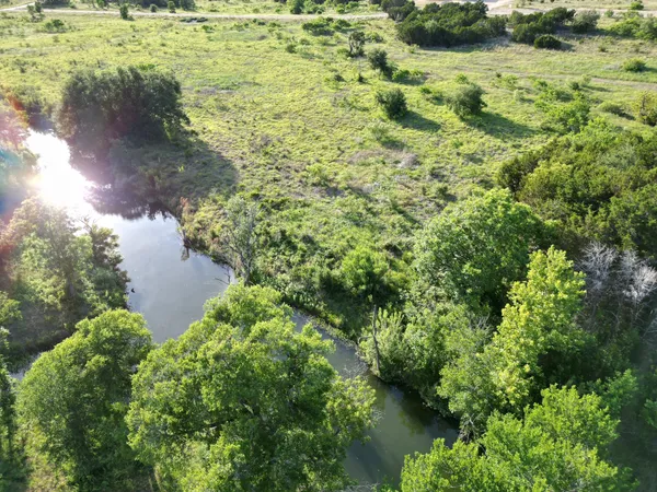 a view of a lake with a yard