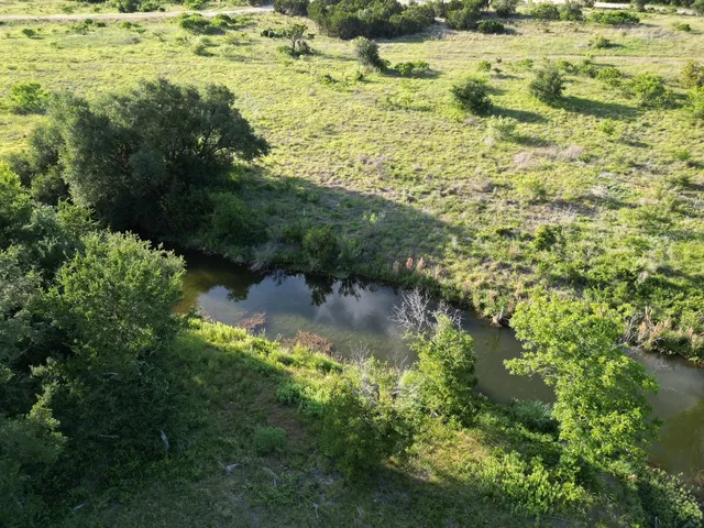 a view of a lake with a yard