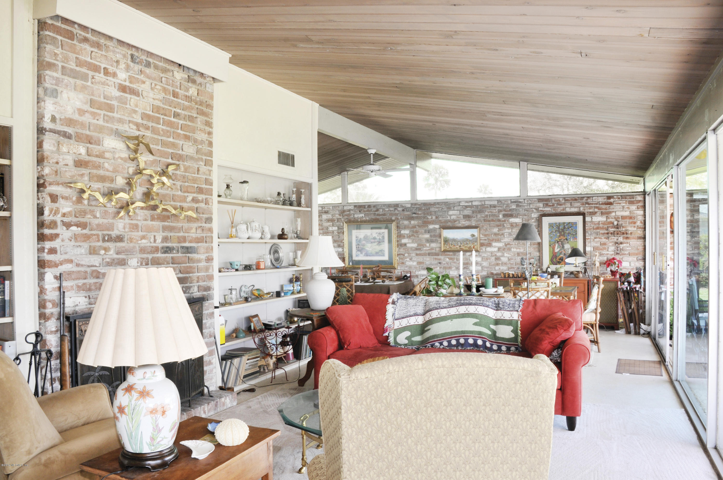 24 Solana Road Ponte Vedra Beach, FL 32082 - Photo 13 of 28 Living Room Fireplace and Book Cases