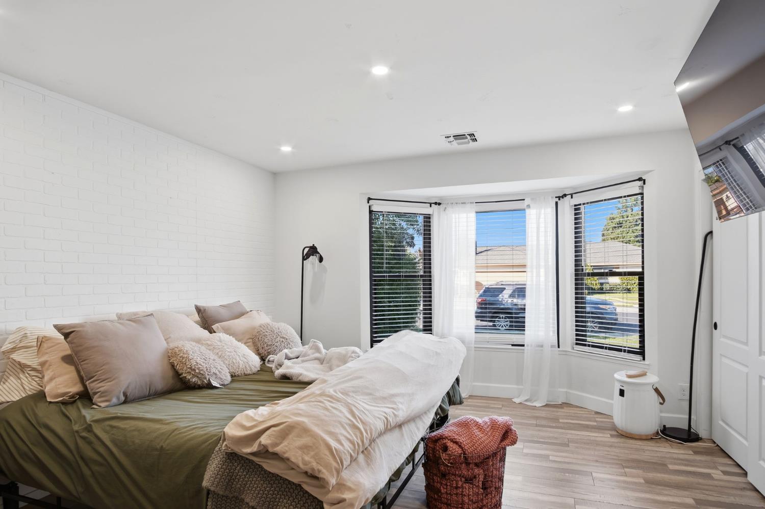 680 Sherri Way Turlock, CA 95382 - Photo 12 of 24 a bed room with a bed and a couch