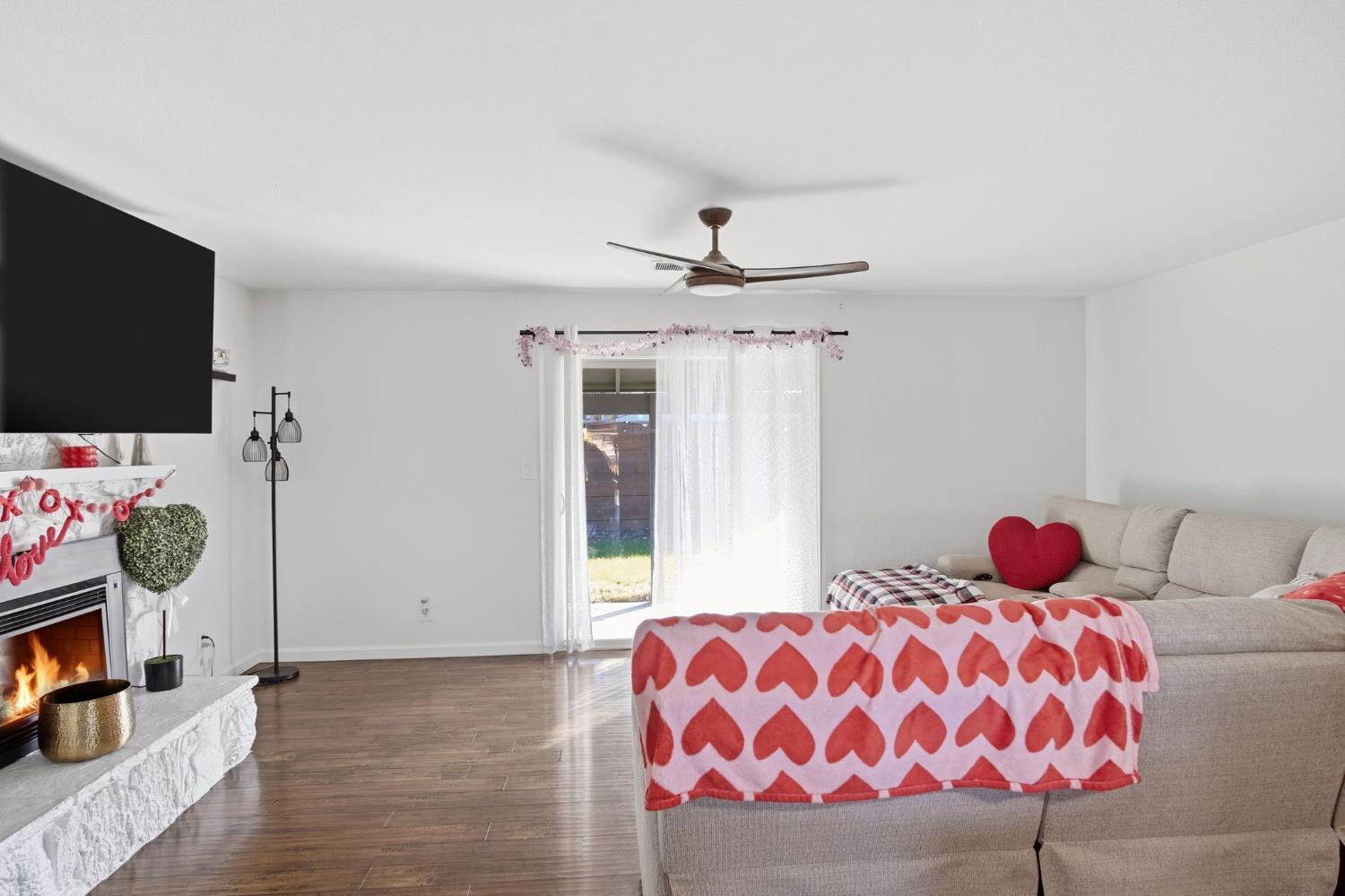 680 Sherri Way Turlock, CA 95382 - Photo 15 of 24 a bedroom with a bed and flat screen tv