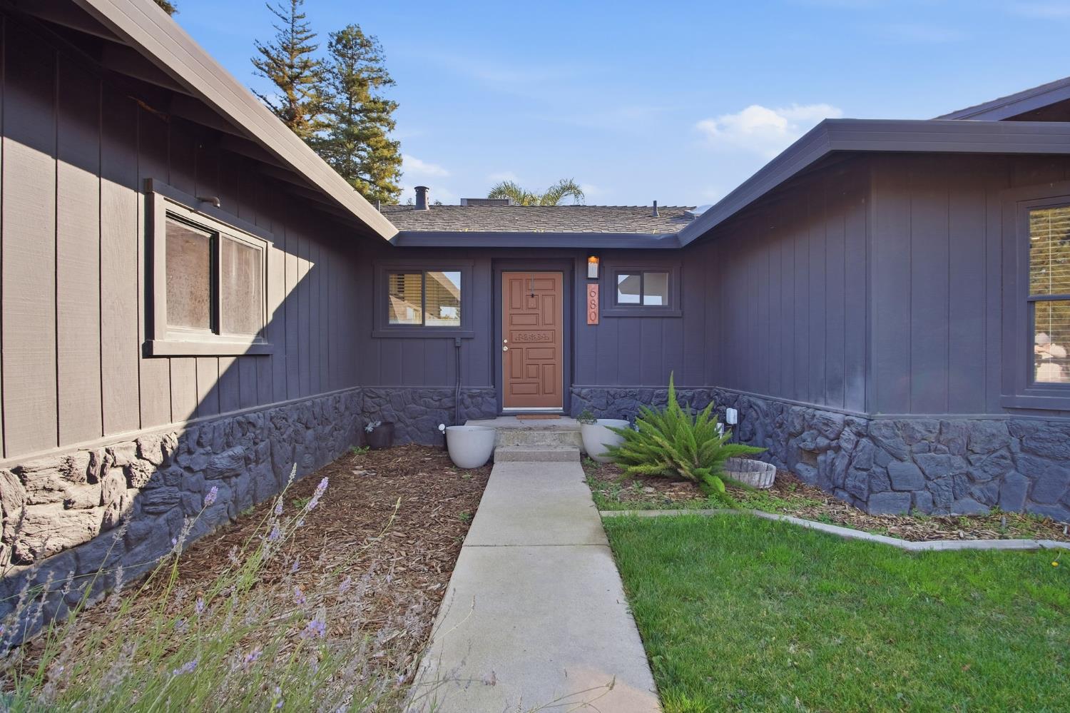 680 Sherri Way Turlock, CA 95382 - Photo 4 of 24 a view of a house with a small yard plants and large tree