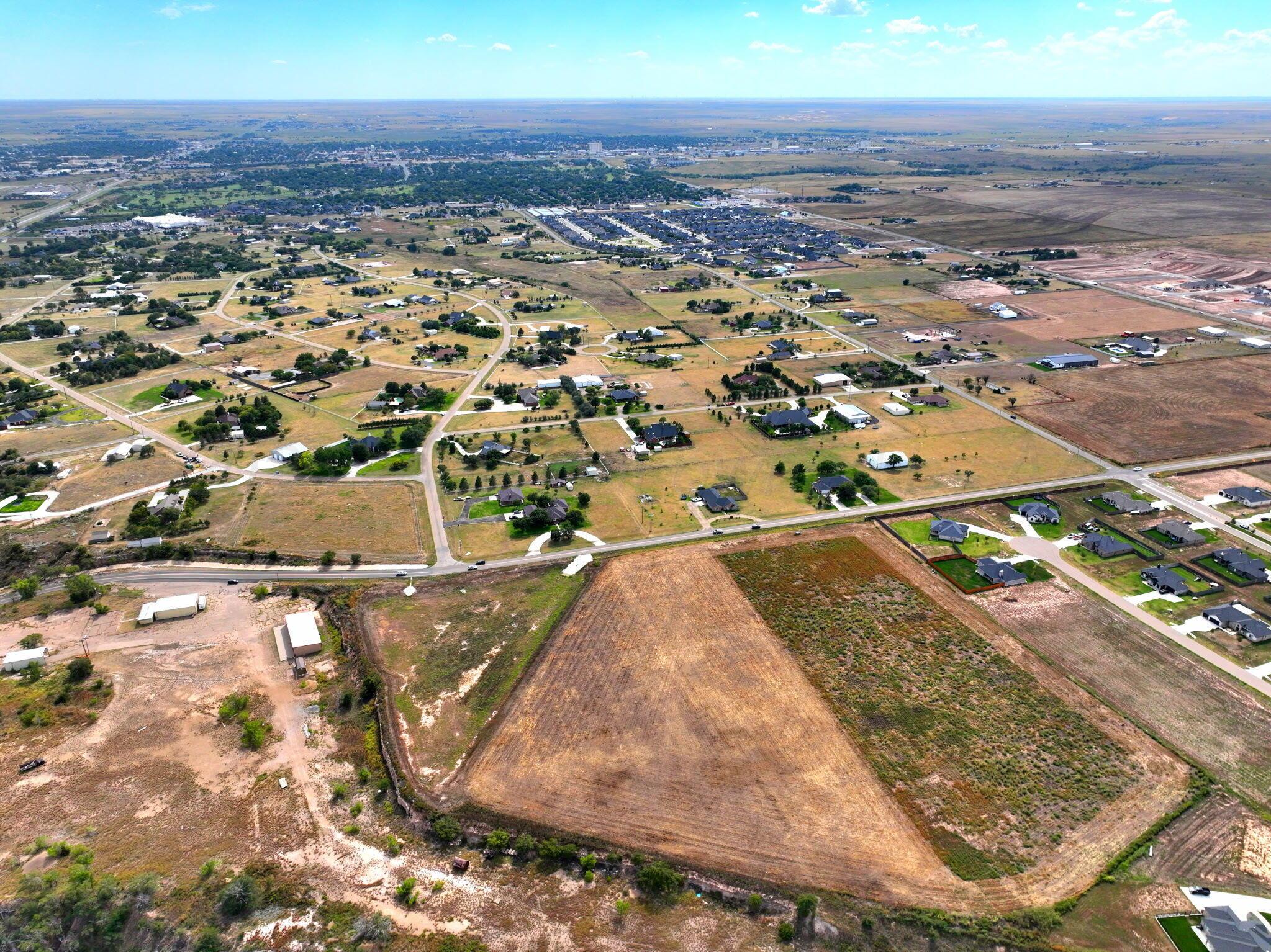 8100 West Country Club Road Canyon, TX 79015 - Photo 3 of 5 an aerial view of residential houses with outdoor space