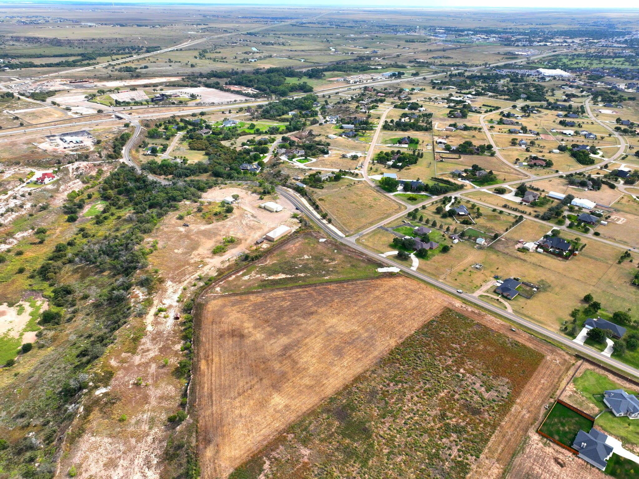 8100 West Country Club Road Canyon, TX 79015 - Photo 4 of 5 an aerial view of residential houses with outdoor space