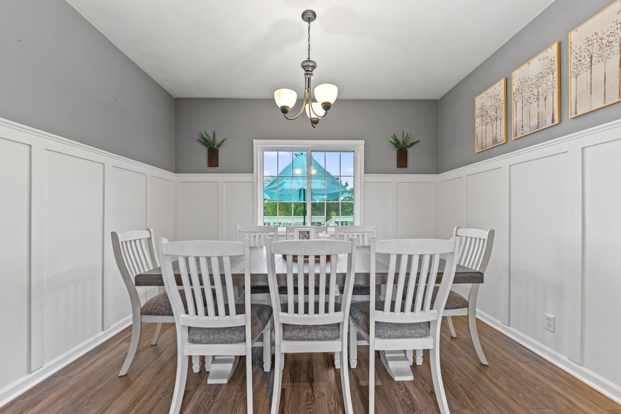 2108 Lake Summerset Road Lake Summerset, IL 61019 - Photo 13 of 53 a view of a dining room with furniture window and wooden floor
