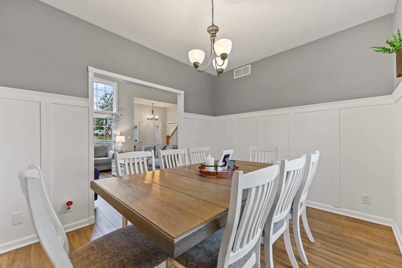 2108 Lake Summerset Road Lake Summerset, IL 61019 - Photo 14 of 53 a view of a dining room with furniture and wooden floor