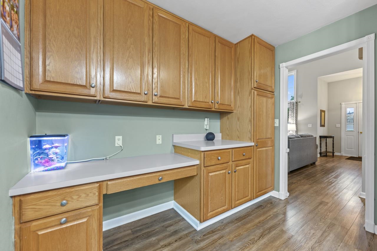 2108 Lake Summerset Road Lake Summerset, IL 61019 - Photo 18 of 53 a kitchen with stainless steel appliances granite countertop a sink and cabinets with wooden floors