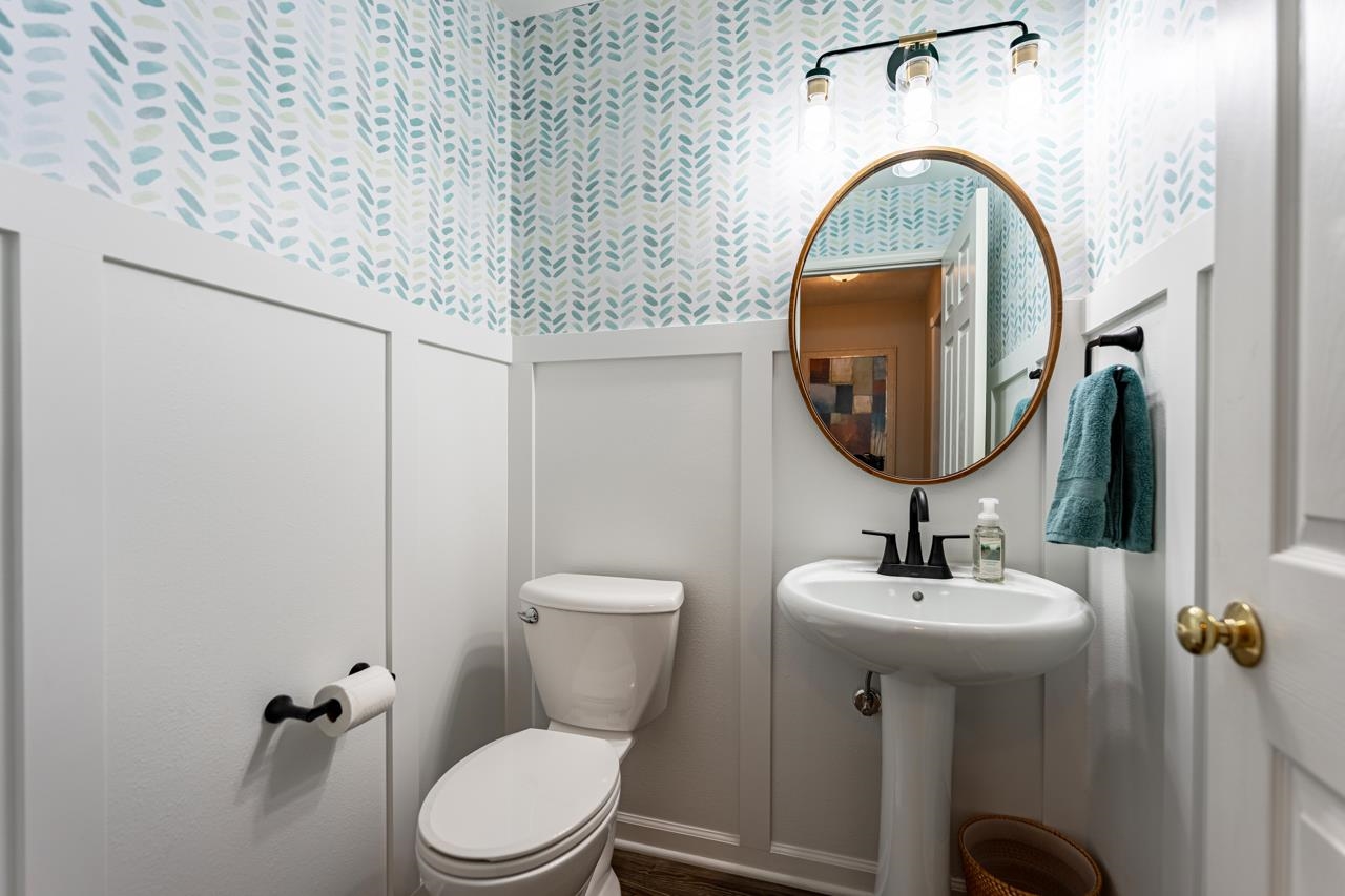 2108 Lake Summerset Road Lake Summerset, IL 61019 - Photo 19 of 53 a bathroom with a toilet sink and mirror
