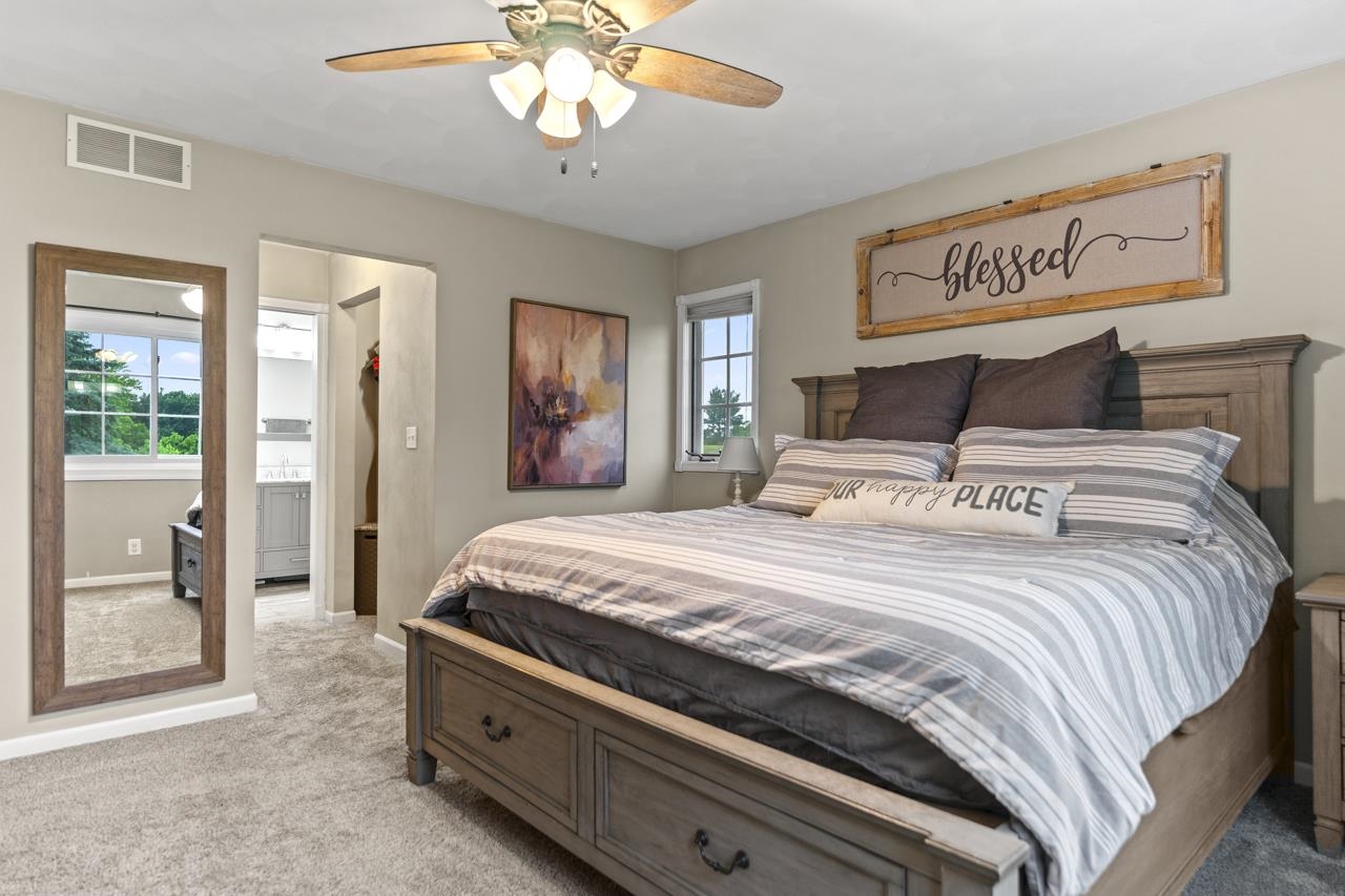 2108 Lake Summerset Road Lake Summerset, IL 61019 - Photo 22 of 53 a bedroom with bed and window