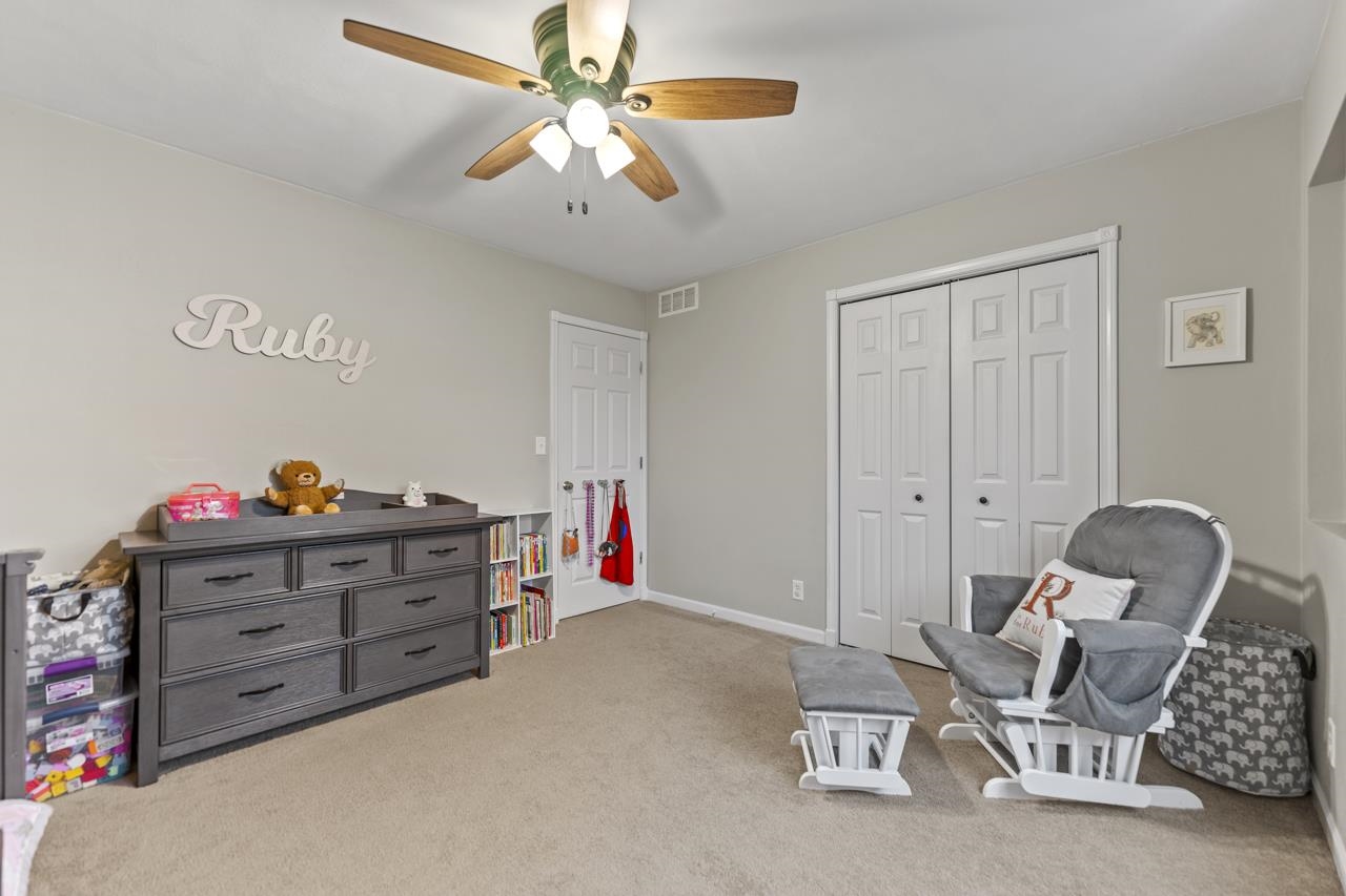 2108 Lake Summerset Road Lake Summerset, IL 61019 - Photo 27 of 53 a bed room with a bed and a chandelier