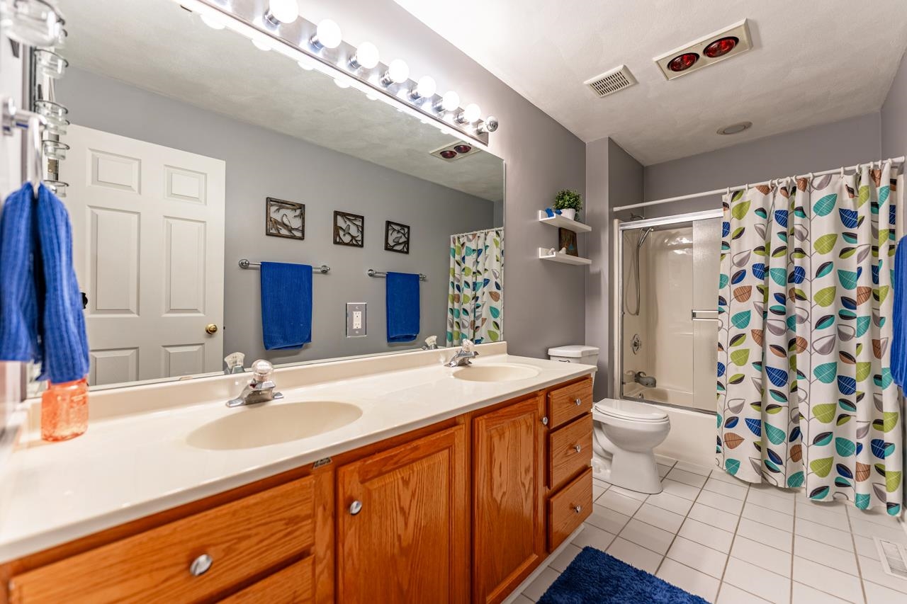2108 Lake Summerset Road Lake Summerset, IL 61019 - Photo 30 of 53 a bathroom with a sink a toilet and shower